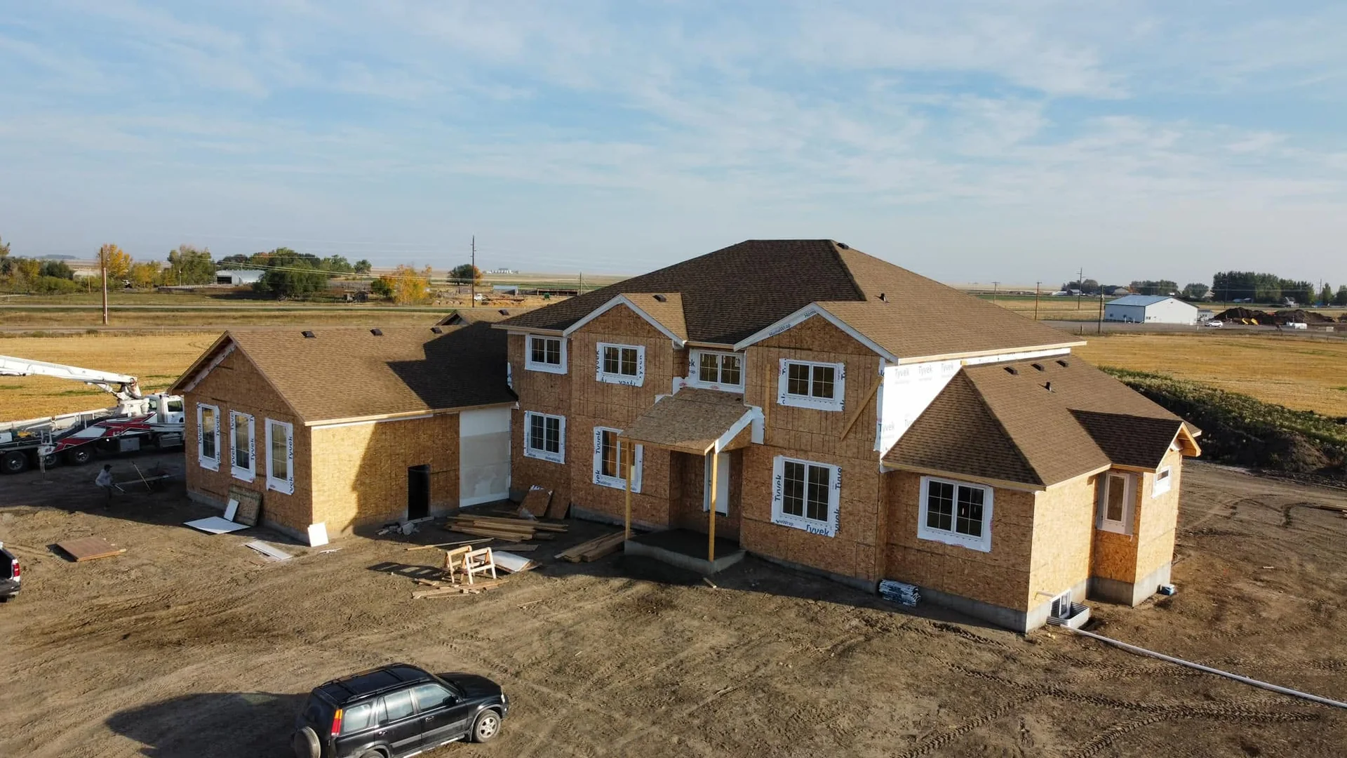 Aerial view of an Anfield home under construction, with roof shingles, windows and exterior sheathing in place