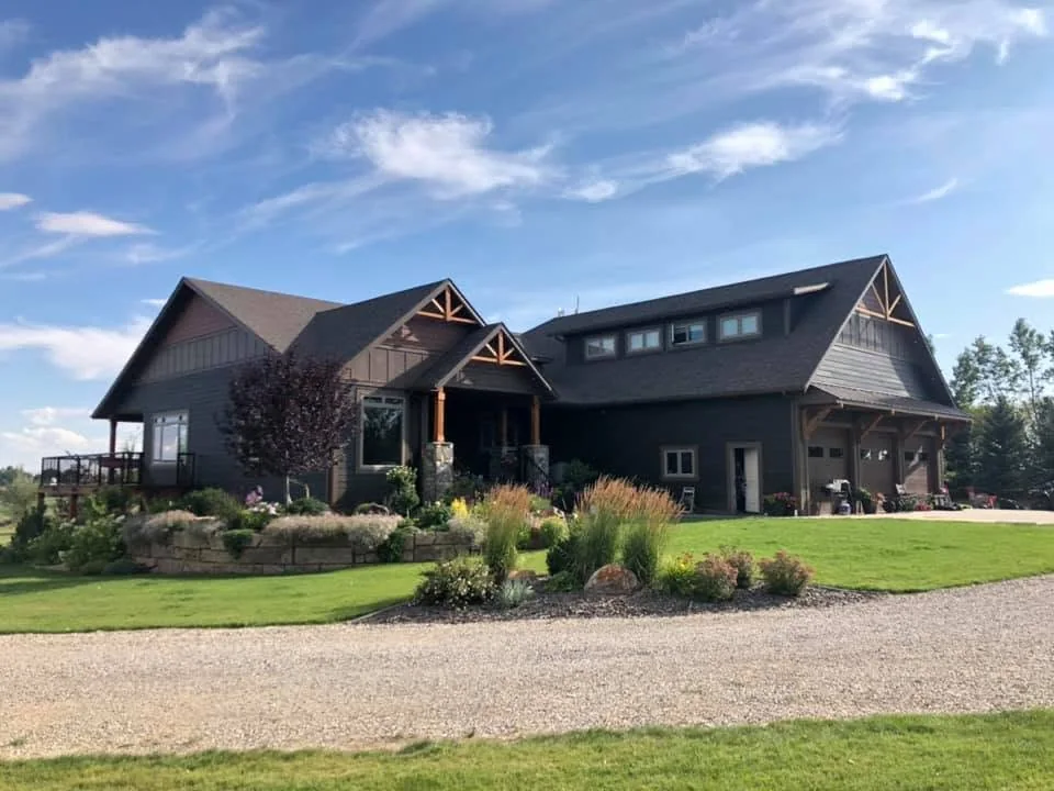Finished dark-sided country home with exposed timber gables and established garden landscaping