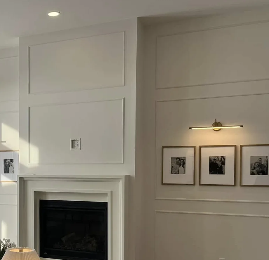 Detail of the panelled fireplace surround and wall trim