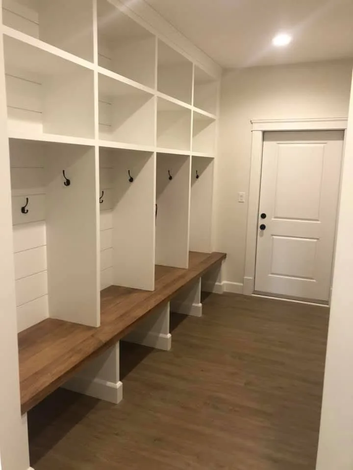 Mudroom lockers with hooks, cubbies and a wood bench